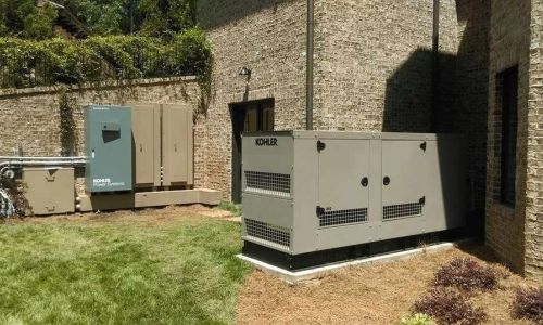 Electrician installing Kohler standby generator in North Georgia home, emphasizing the installation process