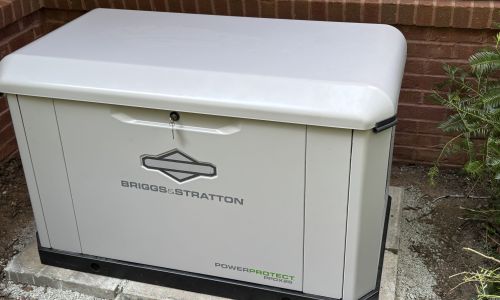 Electrician installing Kohler standby generator in North Georgia home, emphasizing the installation process